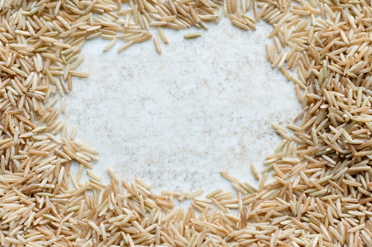 Wheat grains and stalks on white background